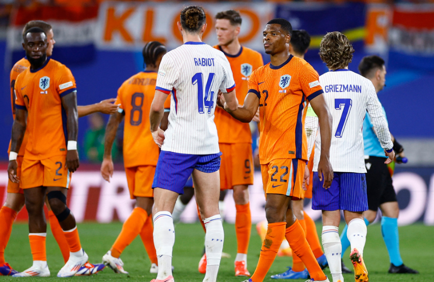 Soccer Football - Euro 2024 - Group D - Netherlands v France - Leipzig Stadium, Leipzig, Germany - June 21, 2024 France's Adrien Rabiot shakes hands with Netherlands' Denzel Dumfries after the match