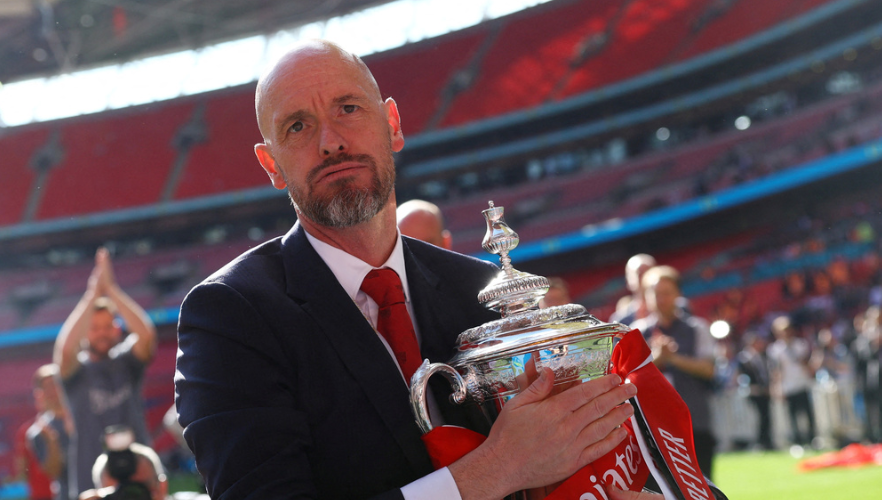 Manchester City v Manchester United - Wembley Stadium, London, Britain - May 25, 2024 Manchester United manager Erik ten Hag celebrates with the trophy after winning the FA Cup