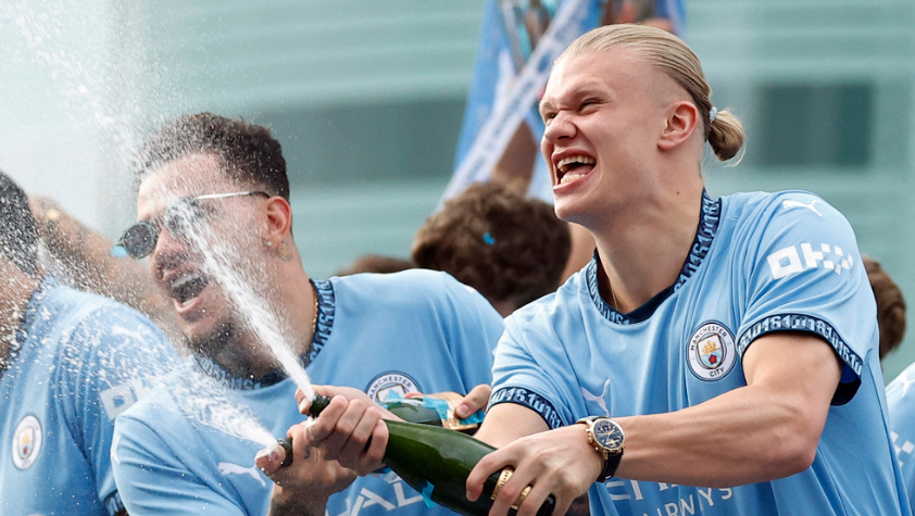  Premier League - Manchester City Victory Parade - Manchester, Britain - May 26, 2024 Manchester City's Erling Braut Haaland and Ederson celebrate on the bus during the victory parade