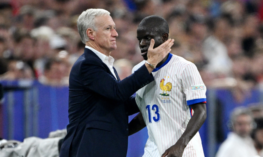 Soccer Football - Euro 2024 - Semi Final - Spain v France - Munich Football Arena, Munich, Germany - July 9, 2024 France's N'Golo Kante with coach Didier Deschamps after being substituted