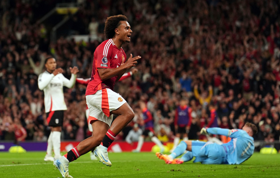 Manchester United's Joshua Zirkzee celebrates scoring their side's first goal of the game during a Premier League soccer match against Tottenham Hotspur at Old Trafford in Manchester, England, Friday, Aug. 16, 2024.