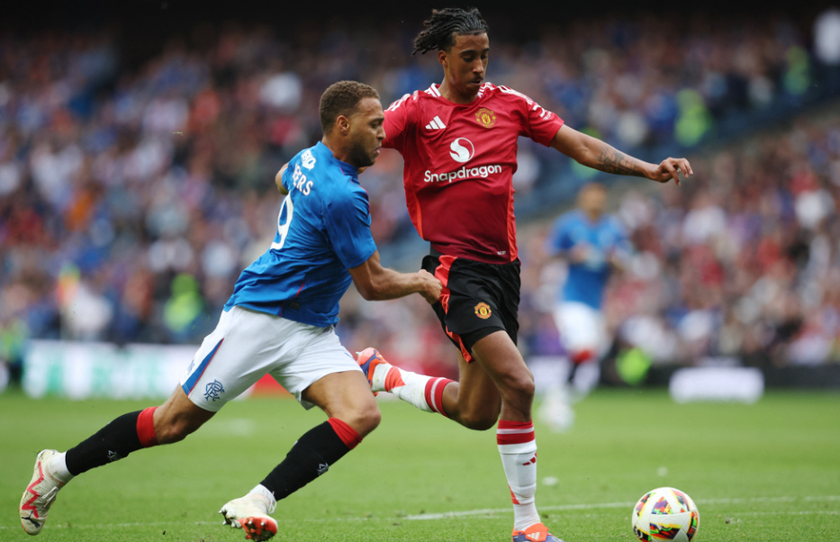 Soccer Football - Pre Season Friendly - Rangers v Manchester United - Murrayfield Stadium, Edinburgh, Scotland, Britain - July 20, 2024 Rangers' Cyriel Dessers in action with Manchester United's Leny Yoro Action