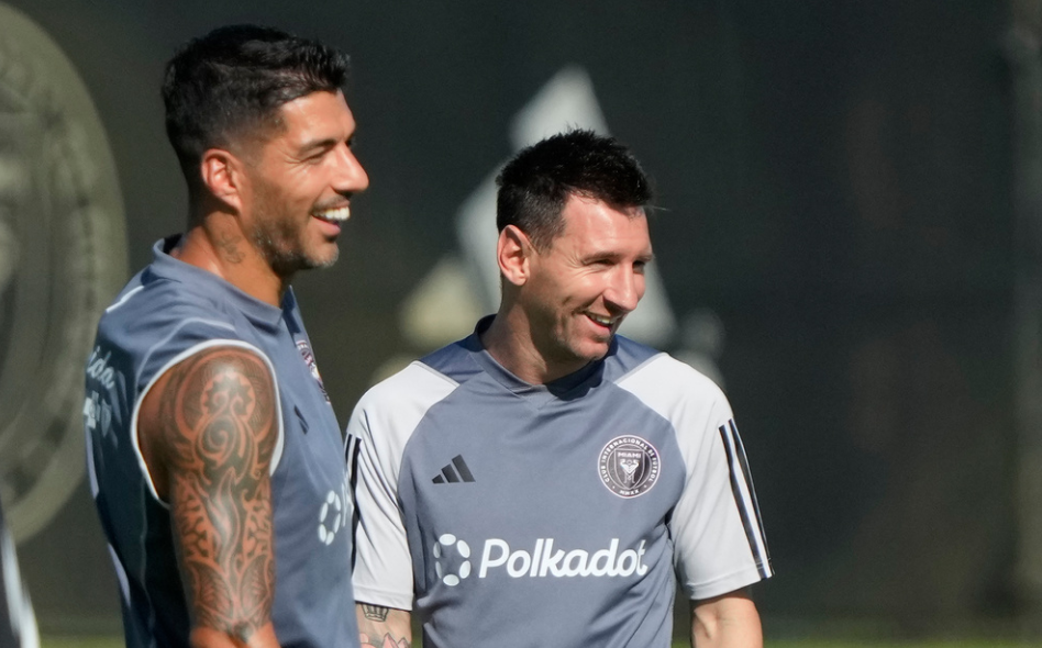 Inter Miami forwards Lionel Messi, right, and Luis Suarez, share a laugh as the work out at the MLS soccer team's training facility, Friday, Sept. 13, 2024, in Fort Lauderdale, Fla