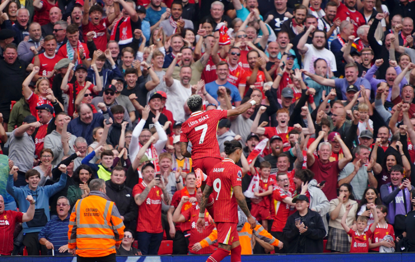 Liverpool's Luis Diaz celebrates scoring his side's second goal of the game, during the English Premier League soccer match between Liverpool and Bournemouth, at Anfield, in Liverpool, England, Saturday, Sept. 21, 2024