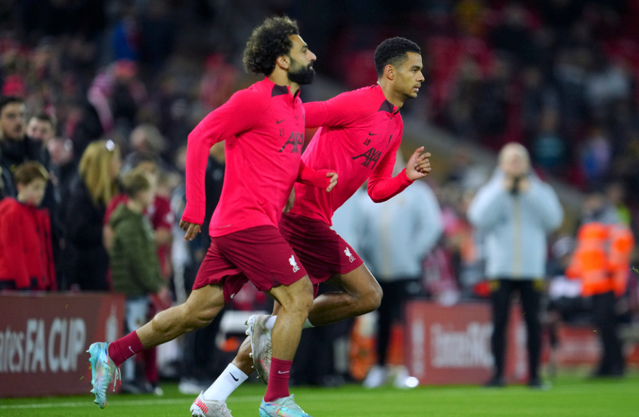 Liverpool's Mo Salah, left, and new signing Cody Gakpo warm-up before the English FA Cup soccer match between Liverpool and Wolverhampton Wanderers at Anfield in Liverpool, England Saturday, Jan. 7, 2023 