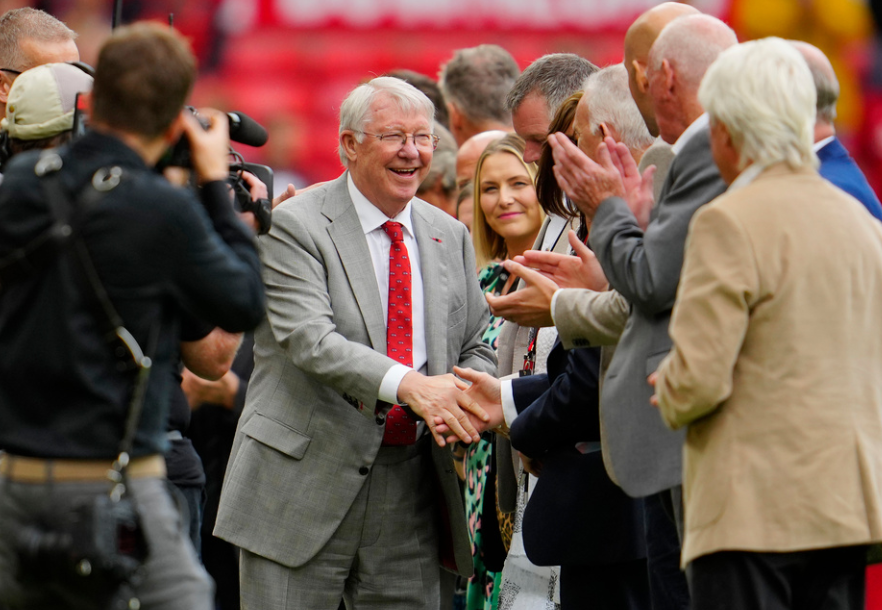 Former Manchester United manager Sir Alex Ferguson, centre, seen ahead the English Premier League soccer match between Manchester United and Nottingham Forest at the Old Trafford stadium in Manchester, England, Saturday, Aug. 26, 2023. 