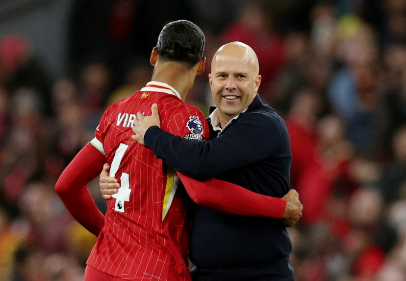 Soccer Football - Premier League - Liverpool v Chelsea - Anfield, Liverpool, Britain - October 20, 2024 Liverpool manager Arne Slot celebrates with Virgil van Dijk after the match