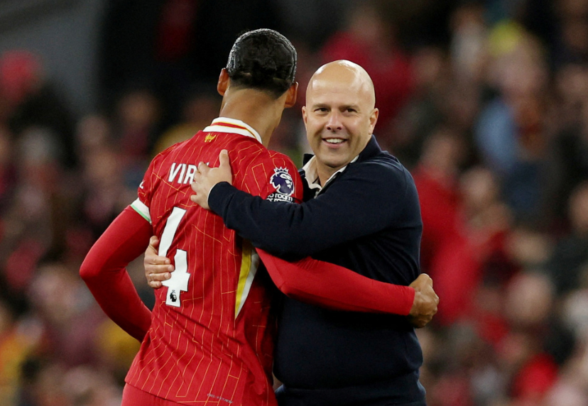 Soccer Football - Premier League - Liverpool v Chelsea - Anfield, Liverpool, Britain - October 20, 2024 Liverpool manager Arne Slot celebrates with Virgil van Dijk after the match 