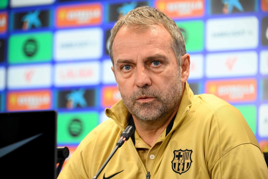 Barcelona's coach Hansi Flick attends a press conference on the eve of the Spanish league football match between FC Barcelona and Atletico de Madrid at the Joan Gamper training ground in Sant Joan Despi, near Barcelona, on December 20, 2024.