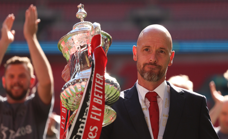 Manchester United's head coach Erik ten Hag celebrates with the trophy after winning the English FA Cup final soccer match between Manchester City and Manchester United at Wembley Stadium in London, on May 25, 2024. Manchester United manager Erik ten Hag has signed a contract extension through to 2026, the Premier League club said