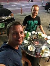 Kim-Andre Nordby has dinner with her little brother Stian at one of the countless street restaurants in Seodamun.  Photo: Private