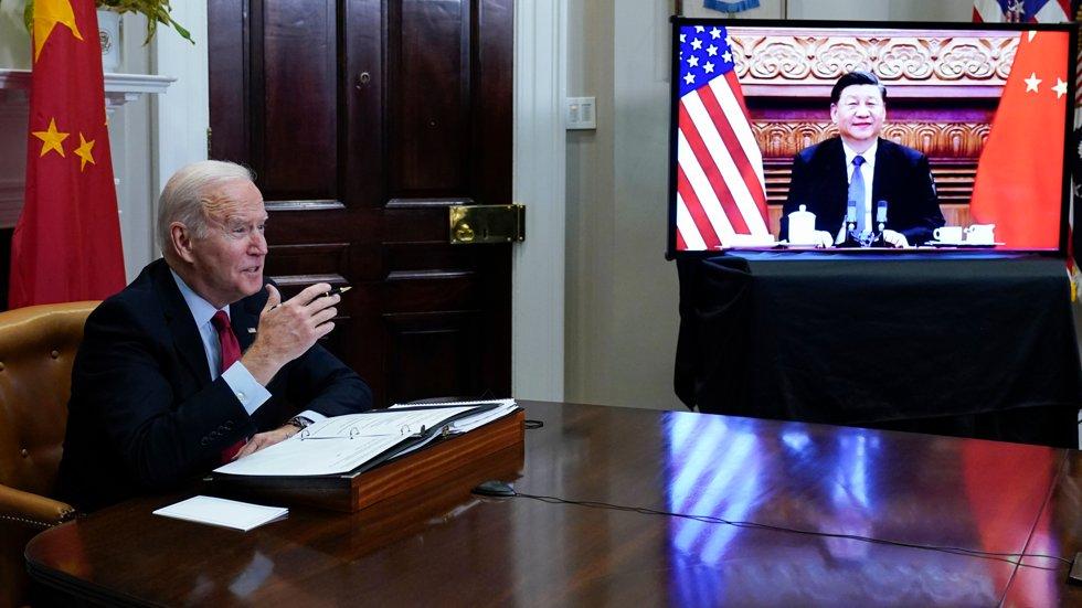 President Joe Biden is on a video call with Chinese President Xi Jinping last November, with Russia's invasion of Ukraine being the main topic.  Photo: Susan Walsh/The Associated Press